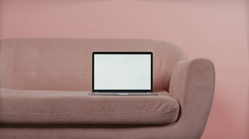 A Laptop Placed on a Couch