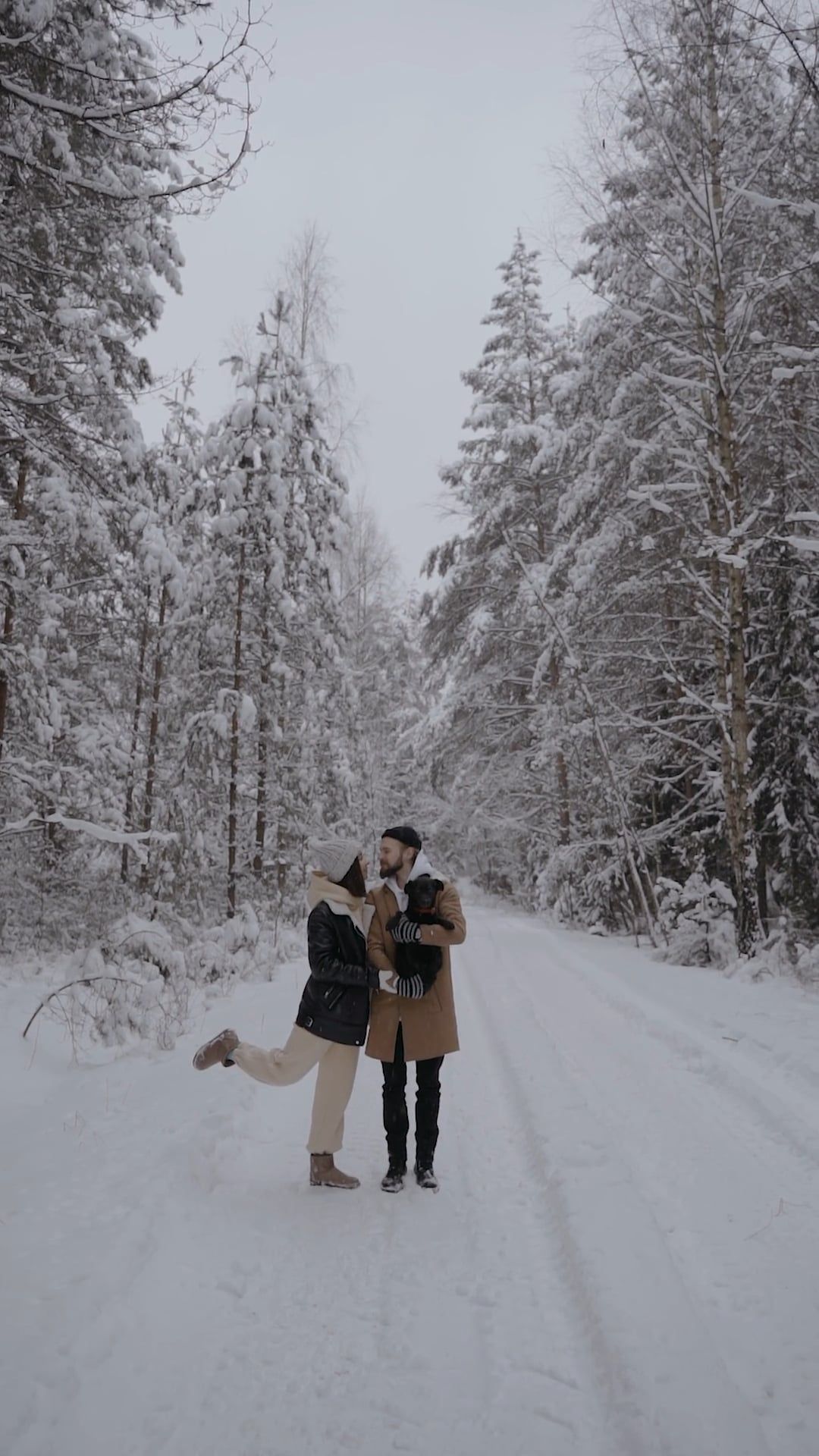 Couple Having a Photoshoot in the Woods during Winter with their Dog ...