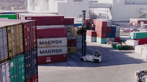 A Forklift Truck Transferring A Cargo Container