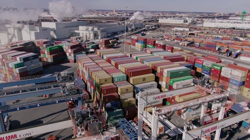 A Drone Footage of a Forklift Truck Transferring a Cargo Container