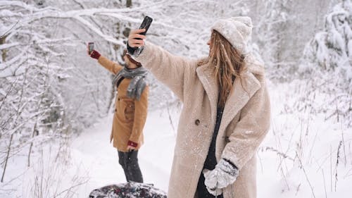 Family Taking Selfies on the Snow