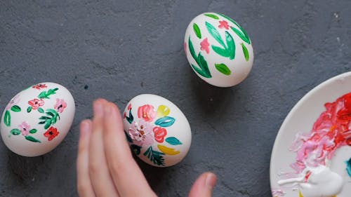 Person Decorating Easter Eggs