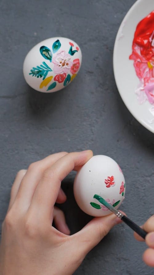 Person Decorating Easter Egg