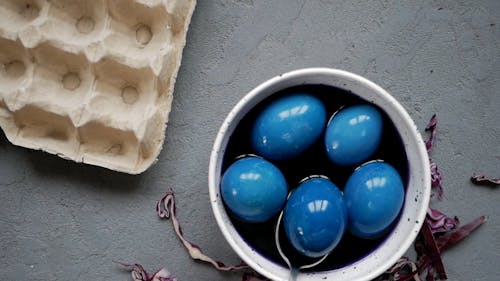 Person Painting Eggs