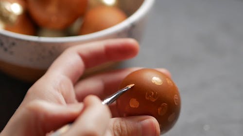 Person Painting Egg
