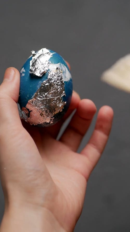 Person Painting Egg