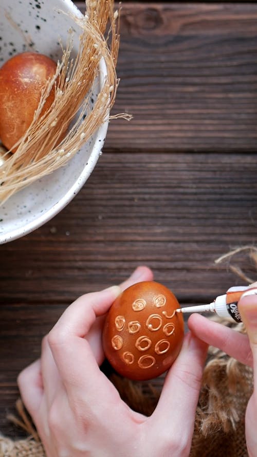 Person Painting Egg