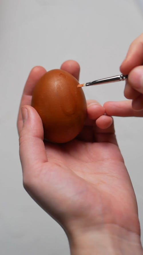Close Up Video of a Person Decorating an Easter Egg