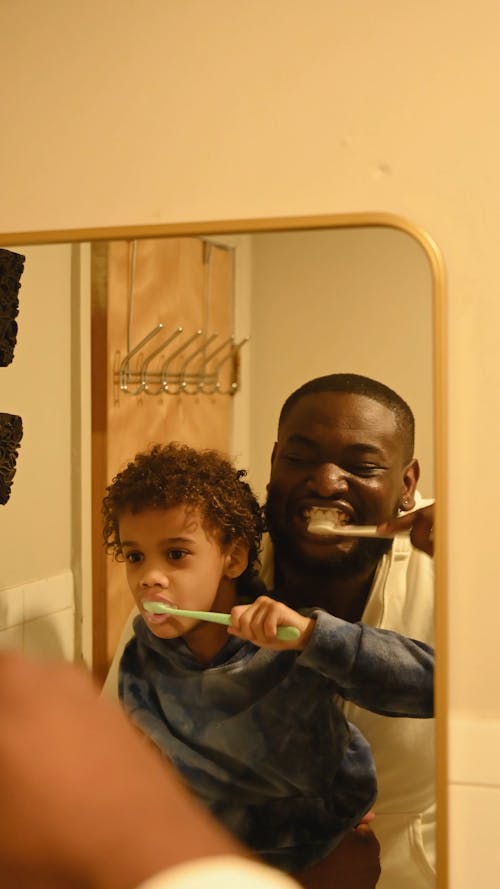 A Video of Father and Son Brushing Their Teeth Together