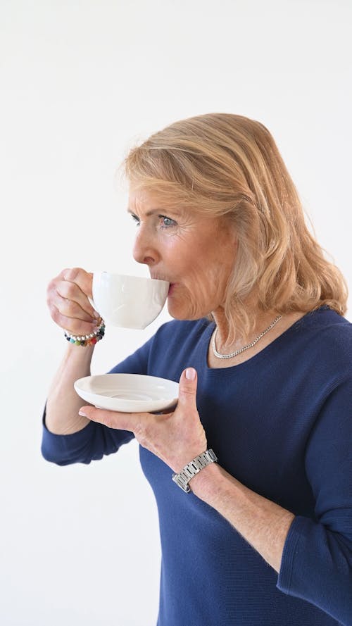 Elderly Woman Drinking Coffee