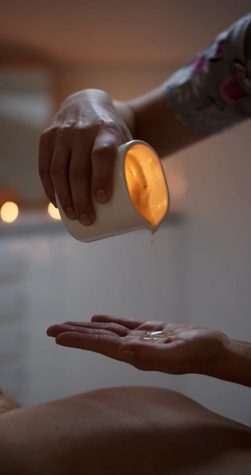 Person Pouring Candle Wax 