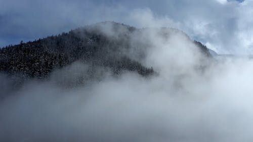 Drone Footage Of A Mountain Valley Covered In Fog