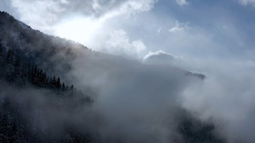 A Drone Footage of a Foggy Mountain