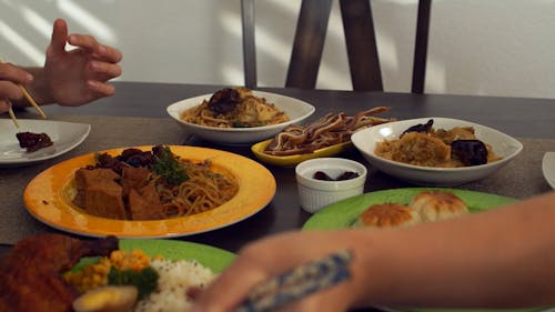 People Eating with Chopsticks