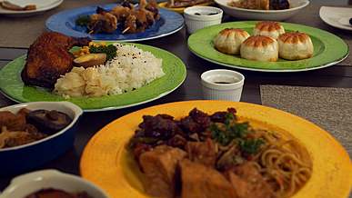 assorted asian dishes on table