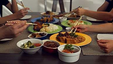people enjoying asian cuisine
