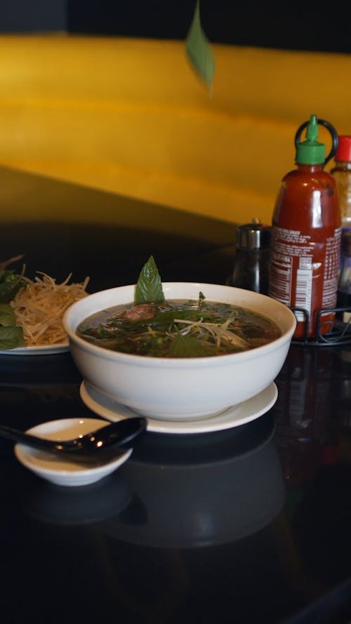 Adding Fresh Herbs to Soup Dish