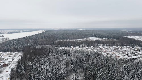 A Drone Footage of a Snow Covered Landscape