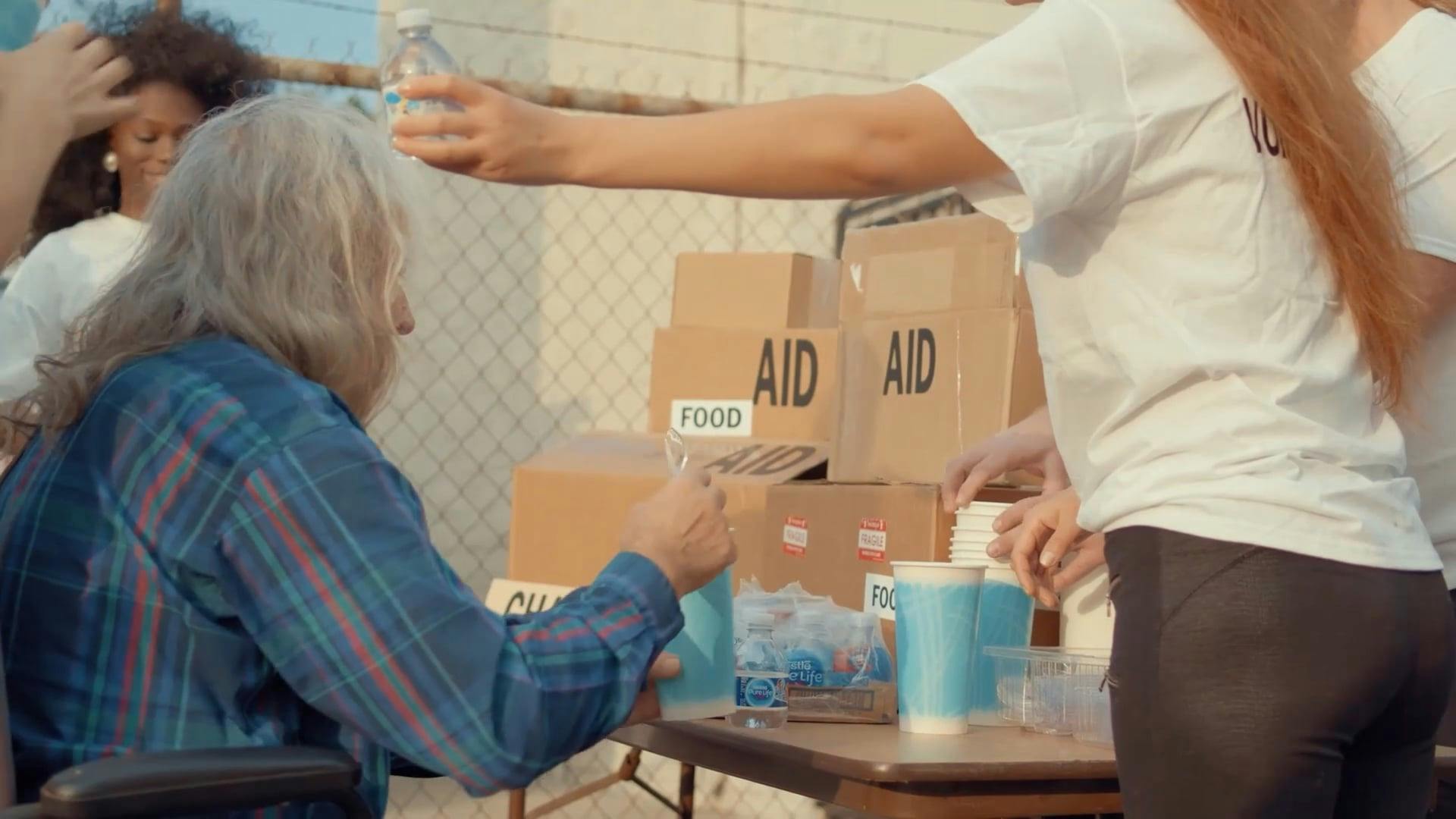 Elderly Man Receiving Donations · Free Stock Video