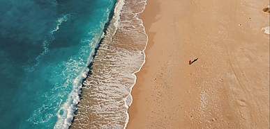 aerial view of a sea shore and mountain