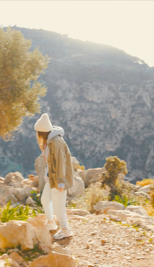 A Person Hiking in a Rocky Area
