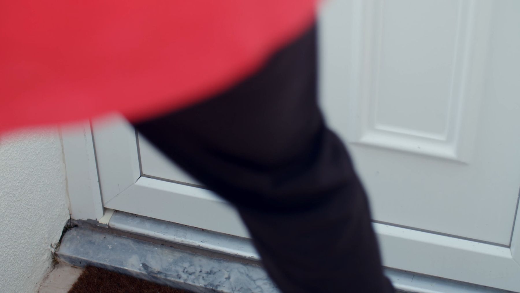 Posh Cleaners concierge delivering a package at a customer's front door