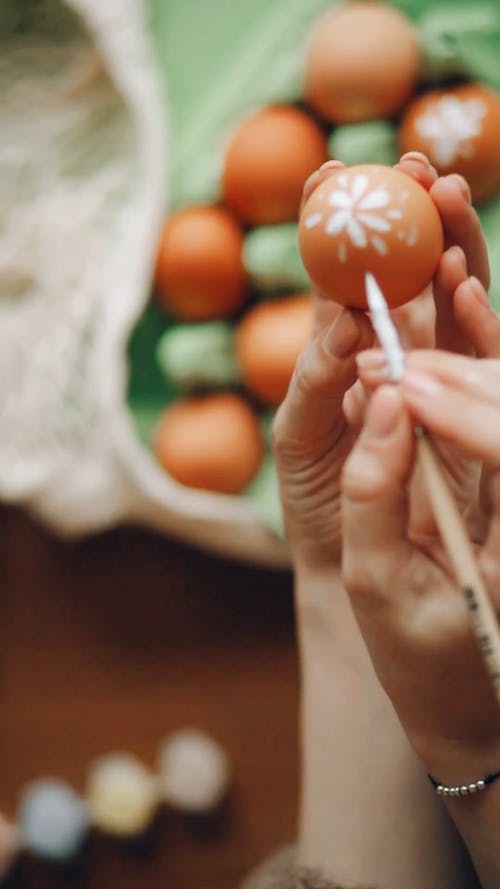 A Person Painting Easter Eggs