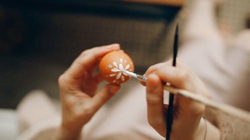 A Person Painting Easter Egg