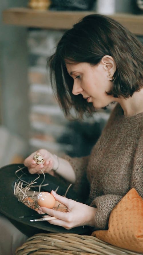A Woman Painting a Quail Eggs