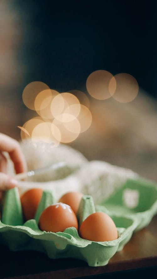 A Person Painting Easter Eggs