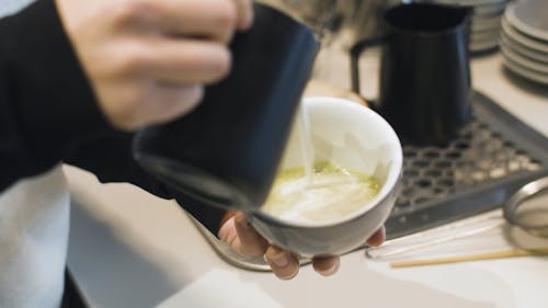 A Person Making Latte