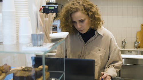 A Woman Working at a Cafe