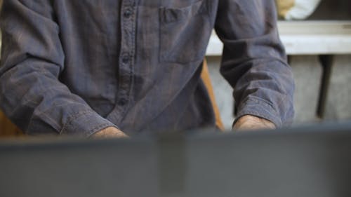 A Person Typing on Laptop