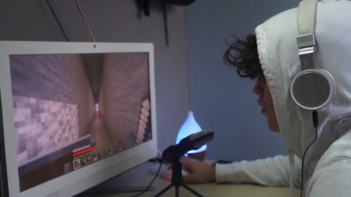 Man Playing Minecraft on his PC