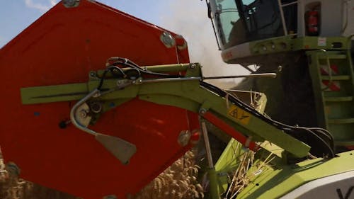 Tractor Harvesting in a Field 