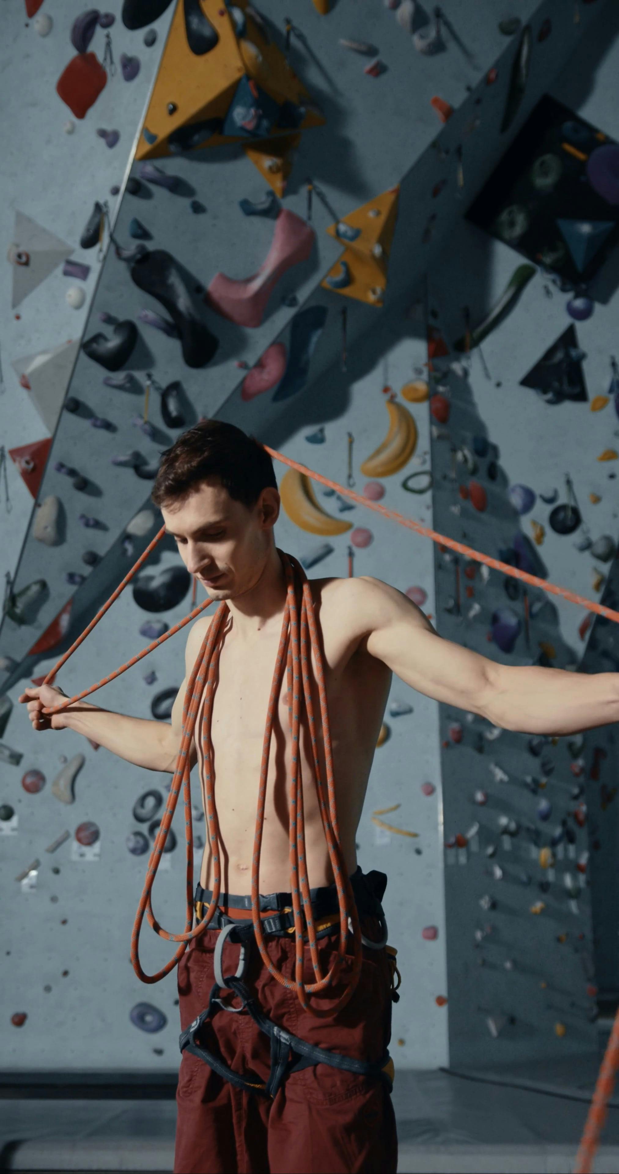 A Man Fixing the Ropes for Wall Climbing · Free Stock Video