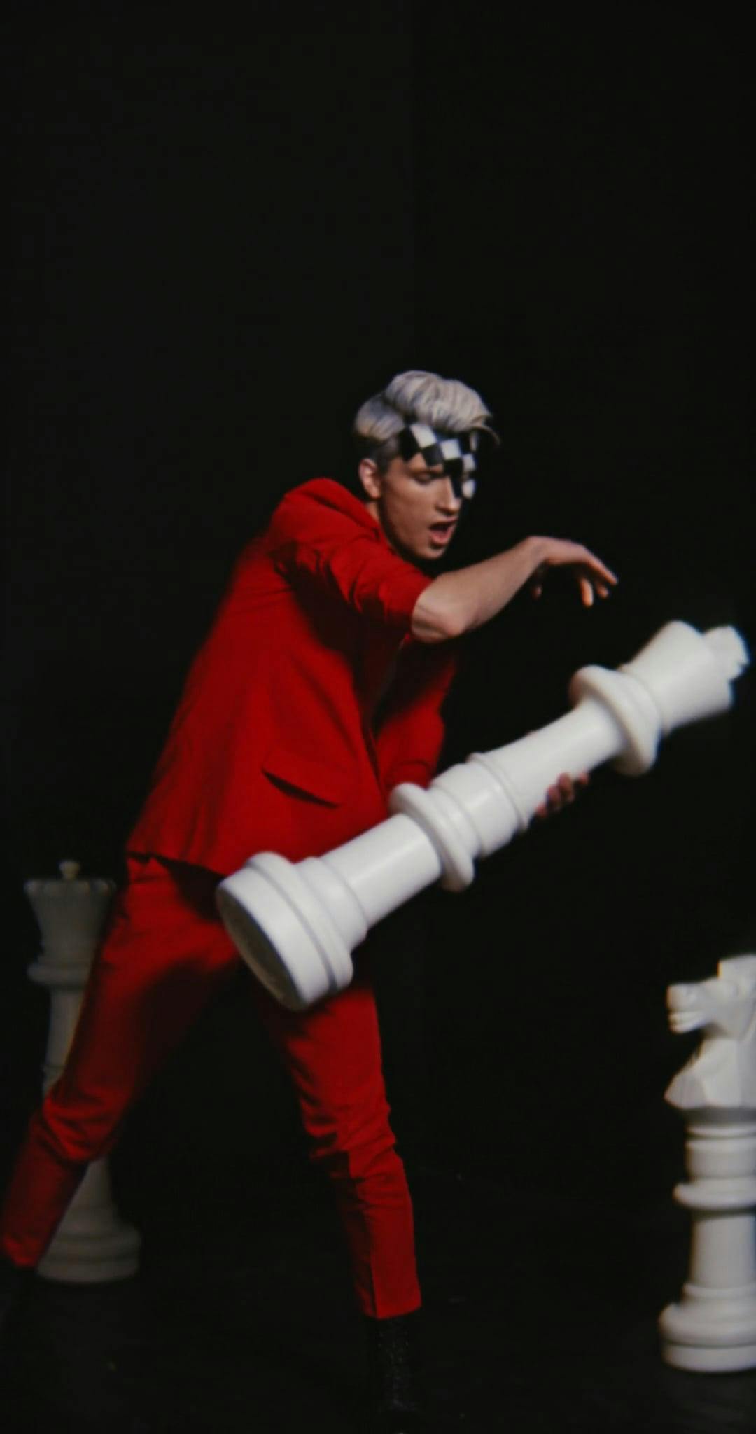 A Vertical Video of a Man Dancing While Holding a Chess Piece · Free