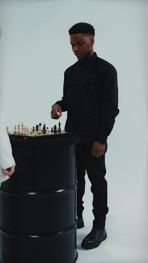 A Man and a Woman Playing Chess