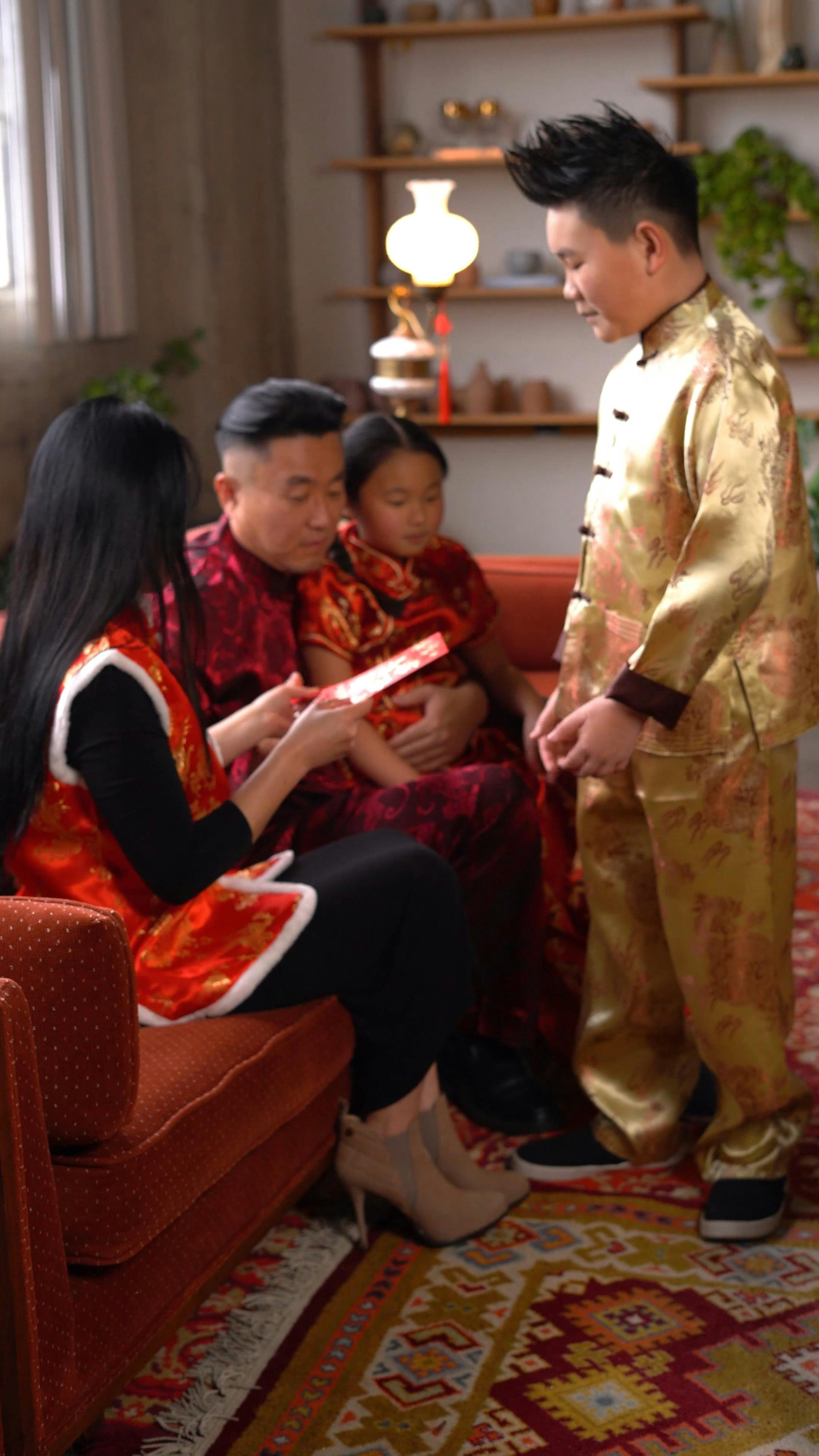 Kids Receiving Angpao From Their Parents Â· Free Stock Video