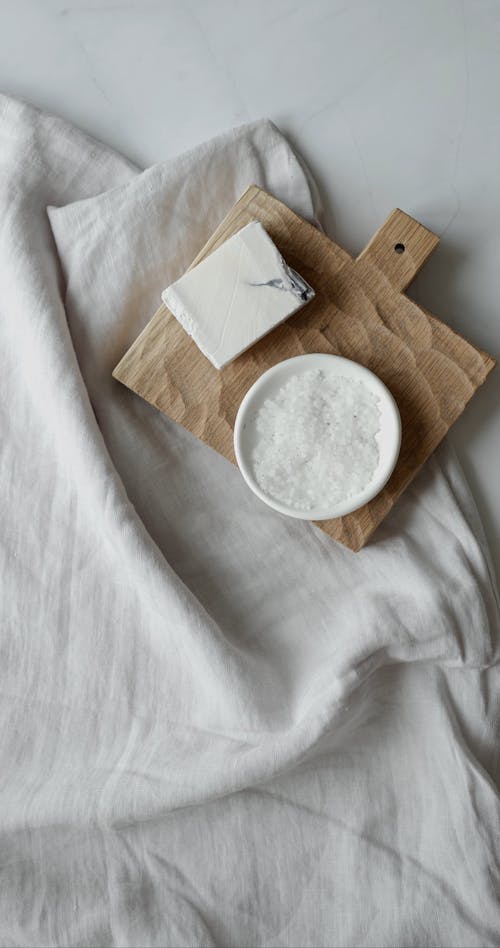 A Flatlay of Bath Salt, Soap, and a Loofah