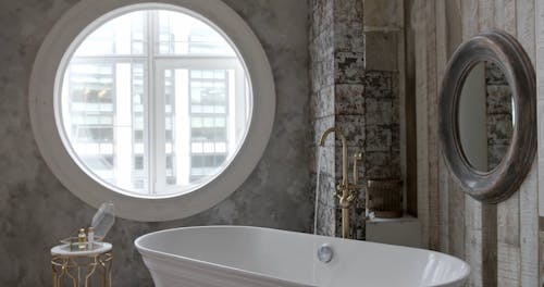 Elegant White Bathtub Being Filled
