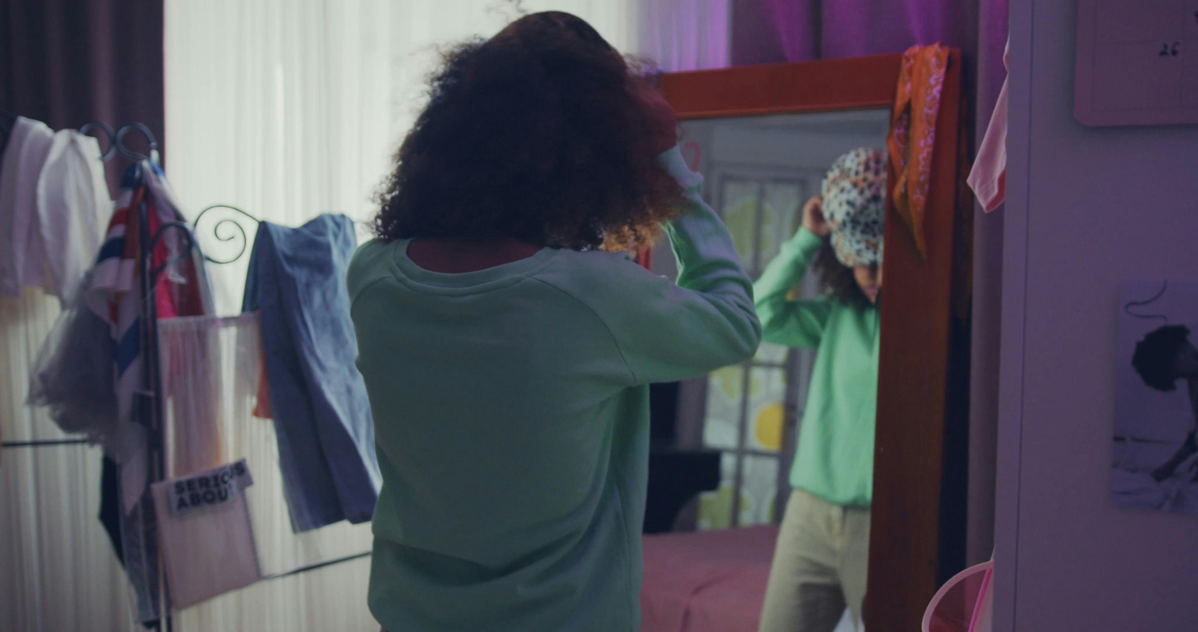 Young Woman Posing in front of Mirror · Free Stock Video