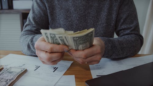 Man Counting Money in the Office