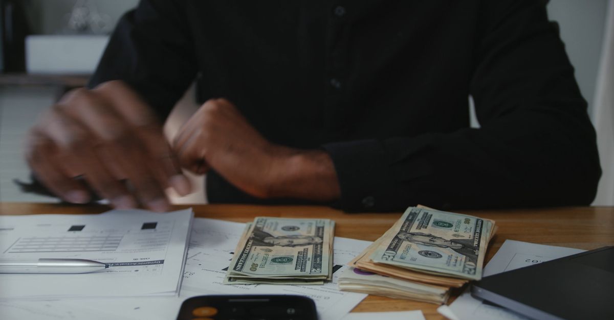 A Man Counting Bank Notes Using Calculator Free Stock Video Footage ...