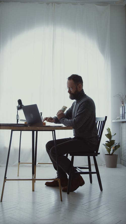 Man Counting Money in the Office