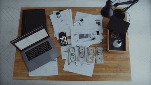 Cash and Documents on Top of the Table