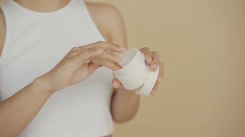 A Woman Applying Facial Cream