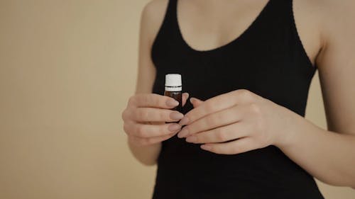 A Woman Using Essential Oil