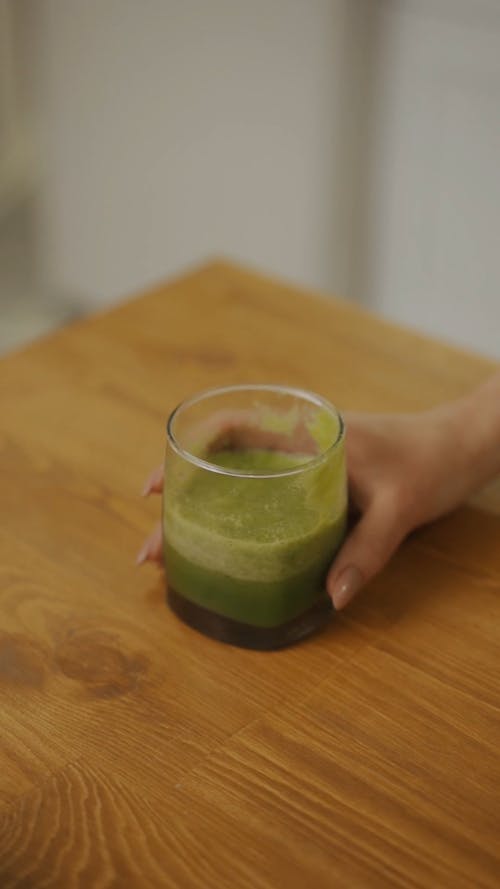 A Woman Drinking A Healthy Smoothie