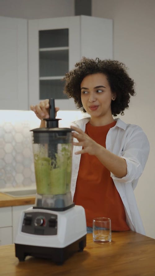 A Woman Making A Healthy Drink